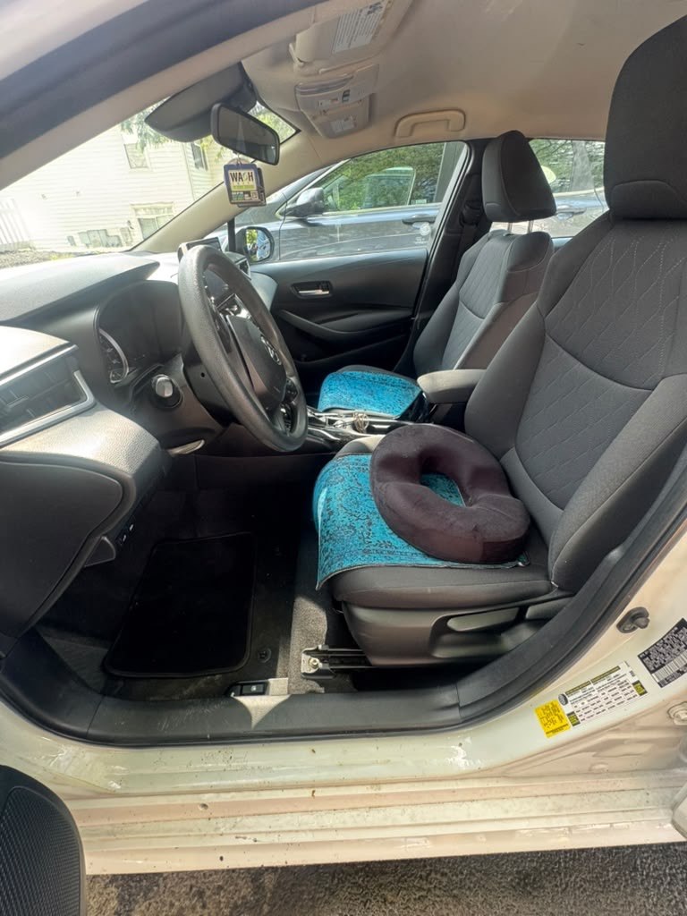 White vehicle interior before professional detailing in Columbus Ohio