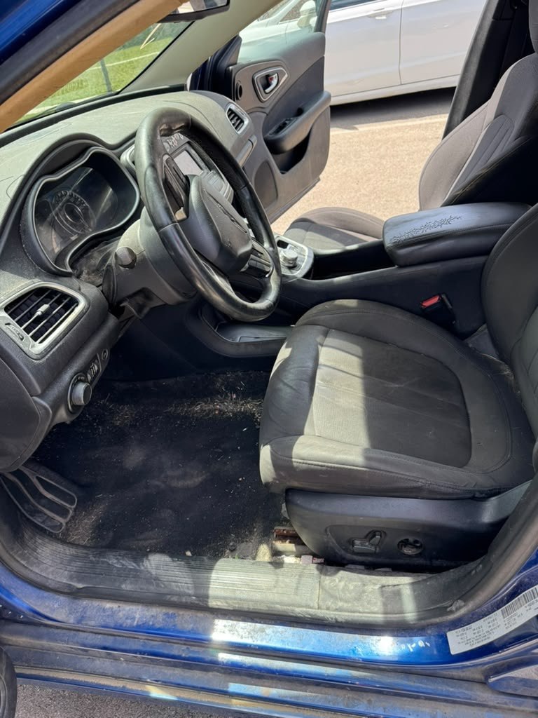 Dirty blue vehicle interior before mobile detailing in Columbus Ohio